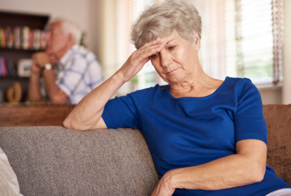 Older adult receiving emotional support and mental health care, highlighting that depression is not a normal part of aging.