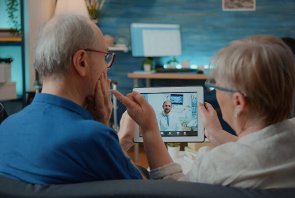 Mental health provider conducting a secure telehealth appointment with an adult patient.